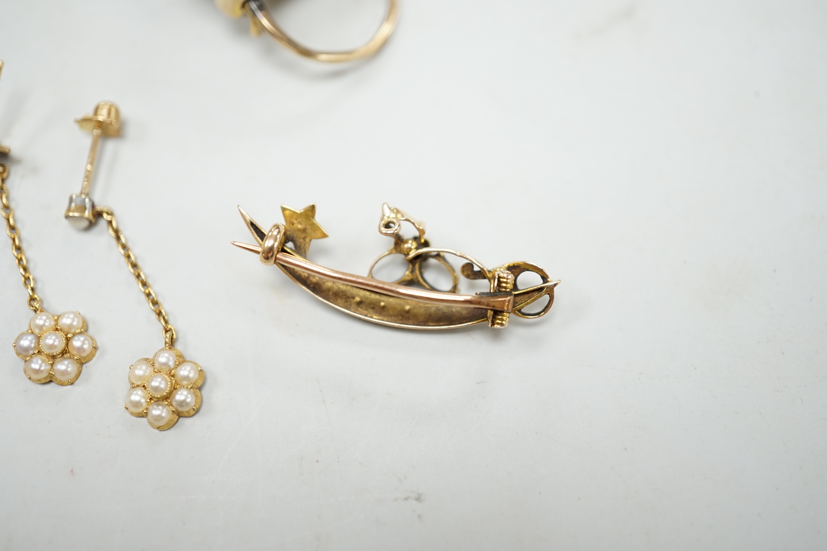 A Victorian yellow metal, garnet and seed pearl set heart shaped locket pendant, 36mm, a pair of Edwardian 15ct and seed pearl cluster set drop earrings and a yellow metal set seed pearl brooch.
